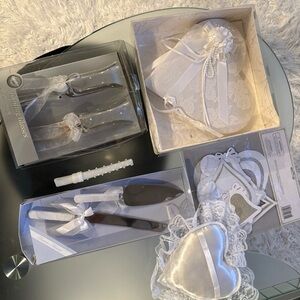 wedding accessories- cake knife, toasting glasses, and a ring pillow